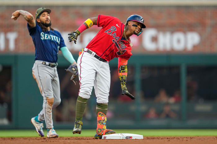 May 19, 2023; Cumberland, Georgia, USA; Atlanta Braves right fielder Ronald Acuna Jr. (13) reacts after hitting a double against the Seattle Mariners during the first inning at Truist Park.